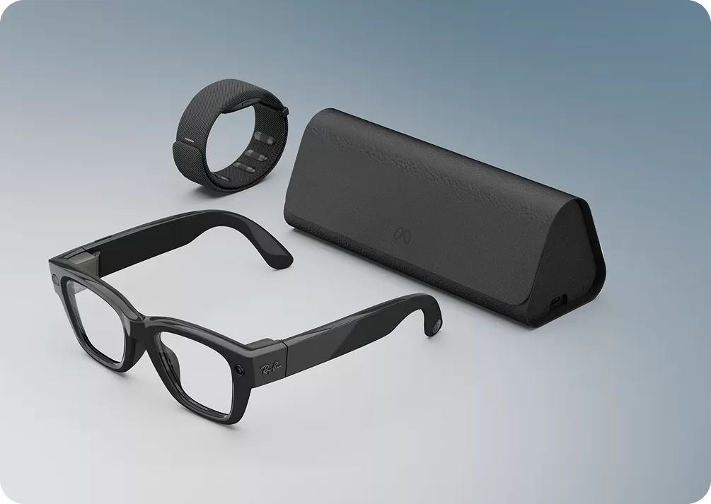 "A product shot of the black Ray-Ban Meta smart glasses, the Meta Neural Band, and the black charging case."