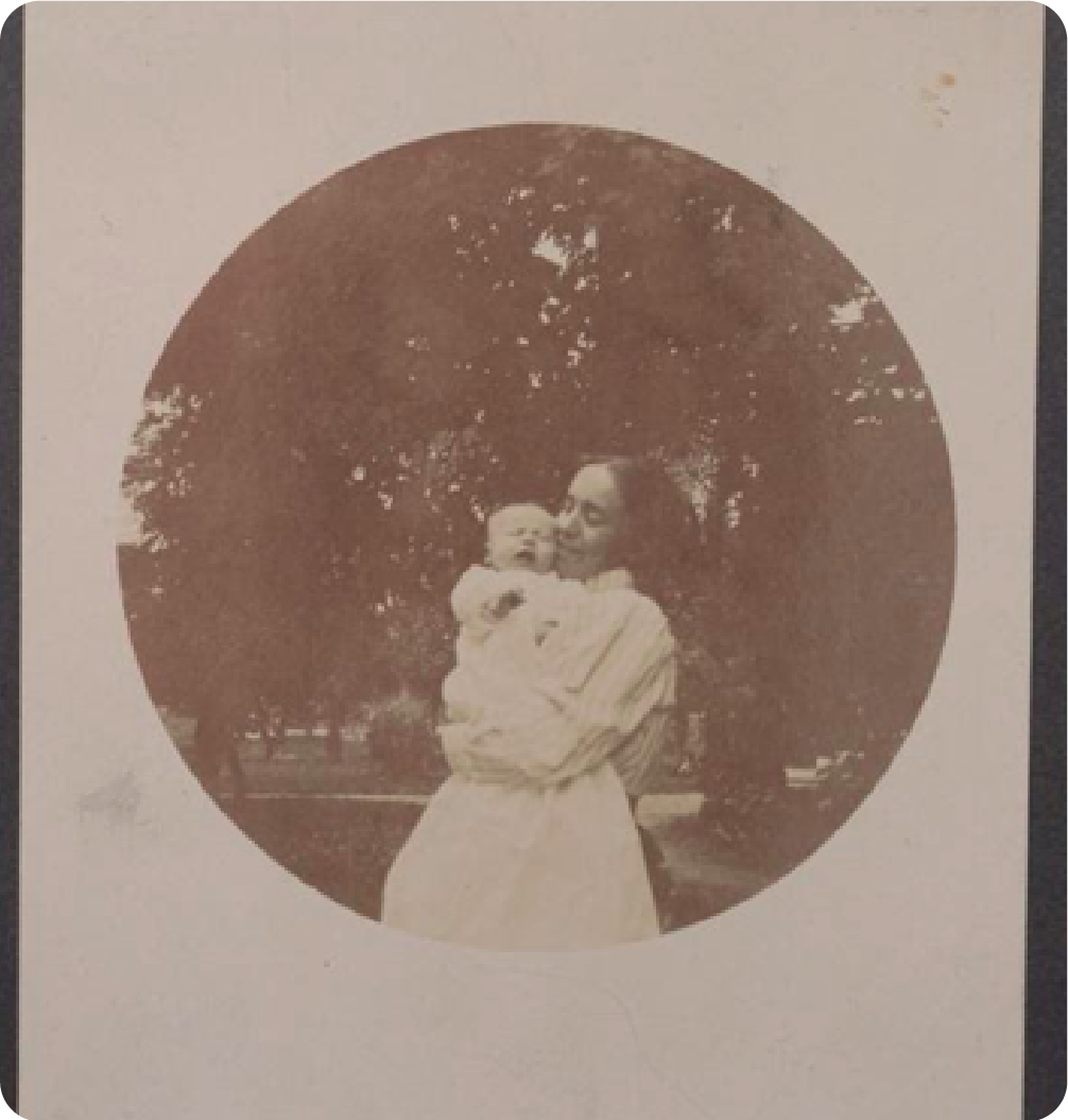 Antique circular tondo photograph of a mother and baby, late 19th-century style portrait in sepia.